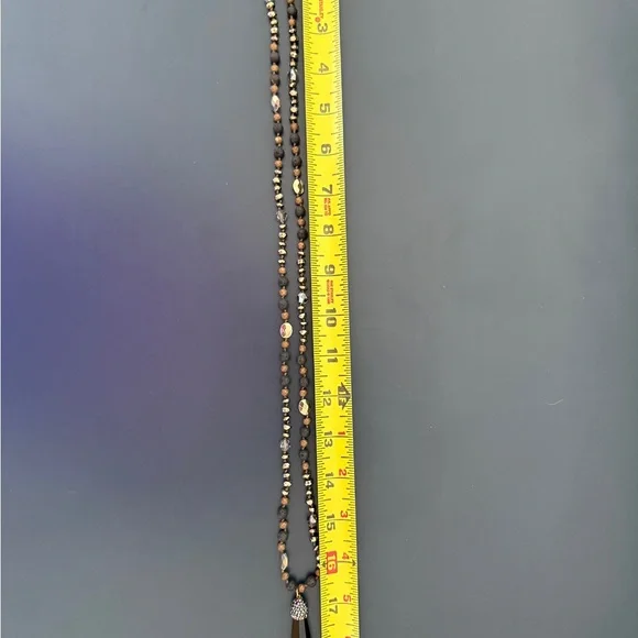 Long necklace with gold, black and brown
Accents - Picture 3 of 3